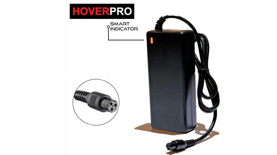 Electric scooter charger plugged into a wall socket for safe home charging in an Indian apartment
